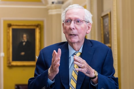A man gestures while speaking.