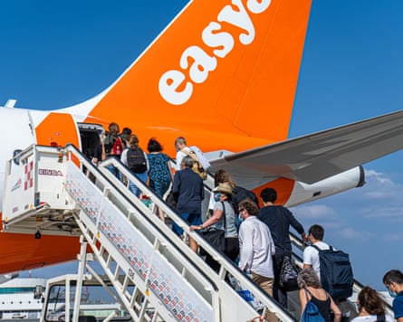 Passengers prepare to board an easyJet flight