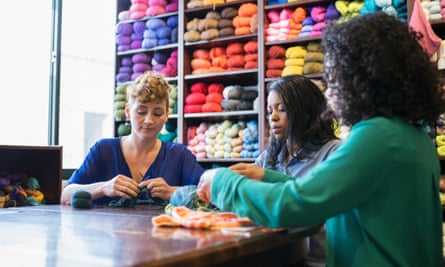 Women knitting in yarn store