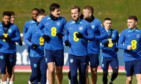 Harry Maguire talks to Harry Kane as players train before England’s Euro 2024 qualification begins