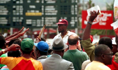 Curtly Ambrose departs with a stump amid the wildly celebrating fans in Trinidad in 1994, after England fell for just 46 runs in the final innings and Ambrose had taken six wickets.