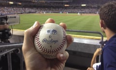 Zack Hample holds the baseball that New York Yankees’ Alex Rodriguez hit on a home run for his 3,000th career hit.