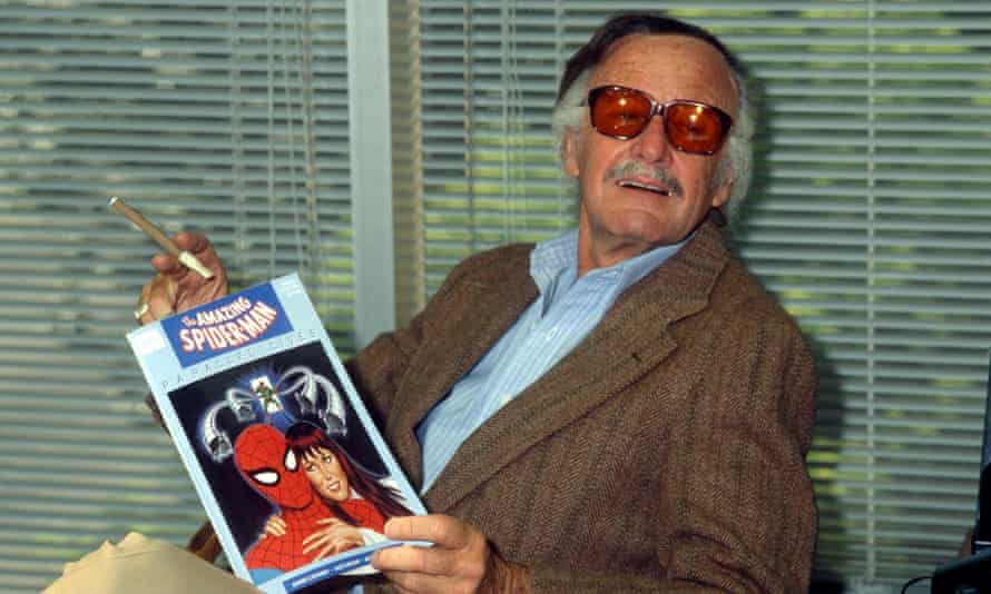 Stan Lee in 1990 with a copy of The Amazing Spider-Man.