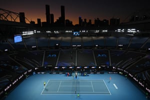 Stefanos pictured serveing to Nadal against Melbourne’s city skyline.