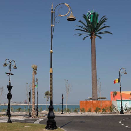 A communications tower disguised as a palm tree near the entrance to the Lusail Winter Wonderland on the man-made island of Al Maha.