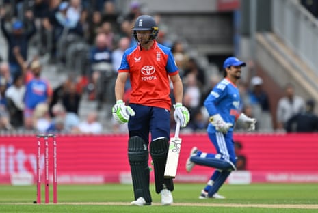England's Jos Buttler reacts after being dismissed