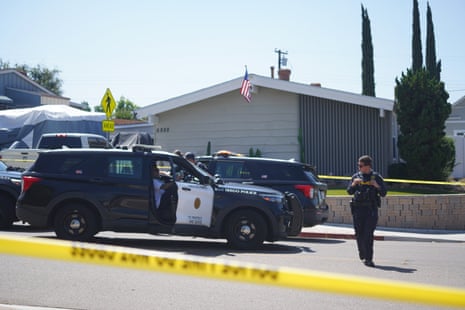 a man next to a police car