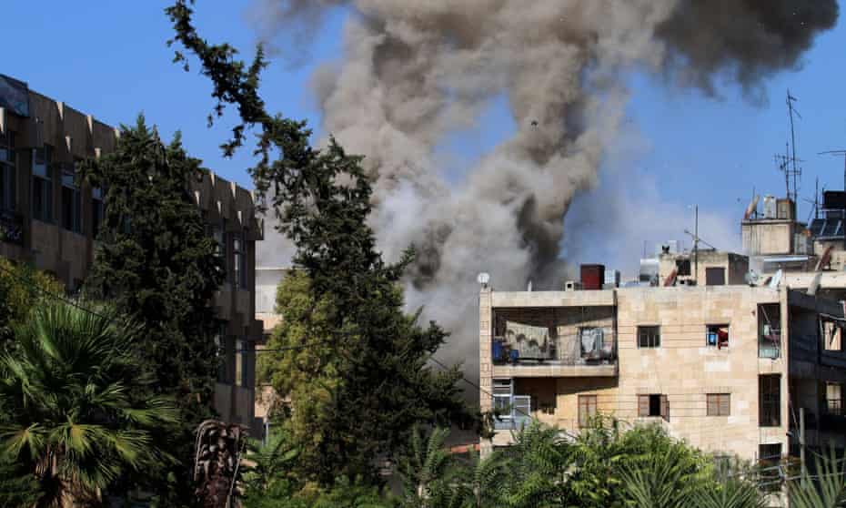 Smoke rises from  a government-held neighbourhood in Aleppo before the ceasefire