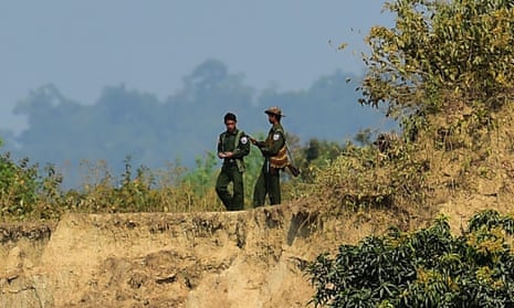 Myanmar soldiers patrol the Bangladesh border