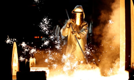 A worker takes a sample from a blast furnace at the German steelmaker ThyssenKrupp. 