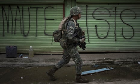 Philippines’ soldiers clear streets in the battle for Marawi in 2017. Local authorities are monitoring Isis foreign fighters, with fears their numbers may have grown.