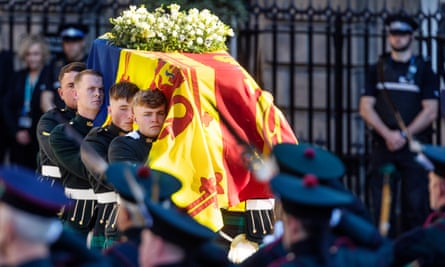 The Queen’s coffin is placed in a hearse on the Royal Mile at St Giles’ Cathedral in Parliament Square, Scotland