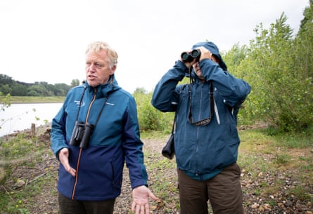 Frans Schepers, left, and Mykhailo Nesterenko of Rewilding Europe next to the Meuse River.