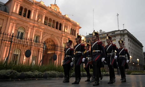 Argentine Grenadiers march to Casa Rosada government house after lowering the national flag at Plaza de Mayo square in Buenos Aires, Argentina on March 17, 2020.