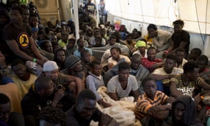 Migrants and refugees aboard the Golfo Azzurro after being rescued as they attempted to cross the Mediterranean Sea to Europe from Libya in June