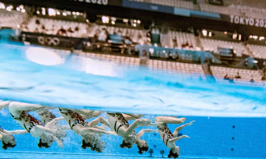 The Canada synchronised swimming team perform at a near-empty Tokyo Aquatics Centre