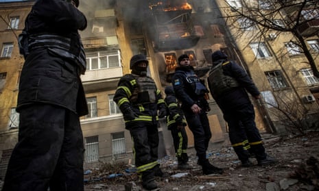 Firefighters work to put out a fire at a residential building hit by a Russian strike in Bakhmut, Ukraine