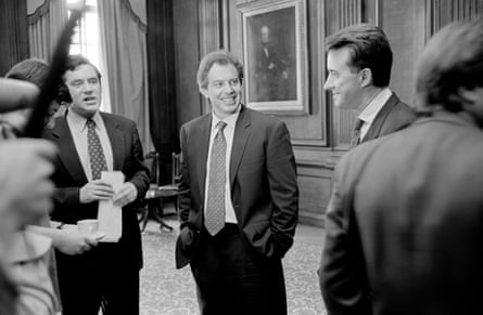 Tony Blair with Gordon Brown and Peter Mandelson at a pre-briefing with staff in 1996.