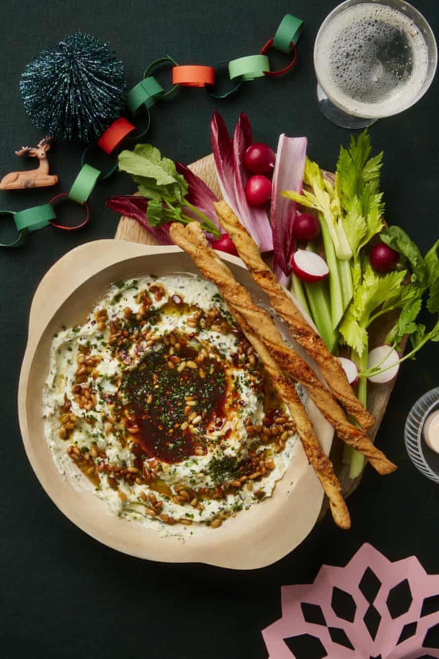 Yotam Ottolenghi's three-cheese dip with spiced date syrup and pine nuts.