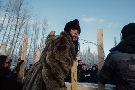 Sabina Dennis stands her ground as police dismantle the barricade to enforce the injunction filed by Coastal Gaslink Pipeline at the Gidimt’en checkpoint near Houston, British Columbia on Monday, January 7, 2019. The pipeline company were given a permit but the Office of the Wet’suwet’en, who have jurisdiction over the territory in question, have never given consent.
