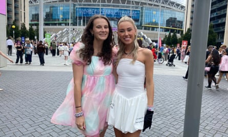 Jaime Haycox, right, and Yasmin Osten, left, in short dresses smiling