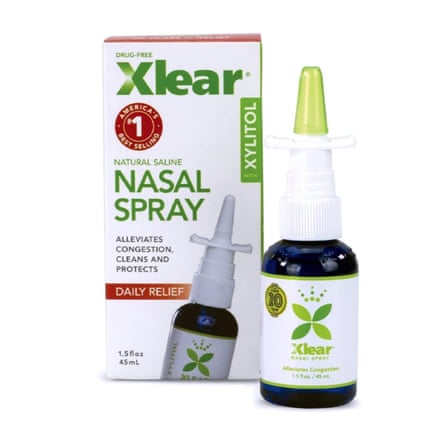Xlear Sinus Care Saline Nasal Spray bottle sits next to its cardboard box packaging.
