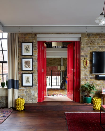 Double doors painted reddish framework the impermanent bedroom.
