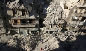 People dig in the rubble in an ongoing search for survivors at a site hit previously by an airstrike in the rebel-held Tariq al-Bab neighborhood of Aleppo, Syria on Monday.