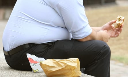 A man eating junk food