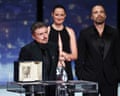 Cristian Mungiu with his Palme d'Or, next to cast members Sebastian Stan and Renate Reinsve