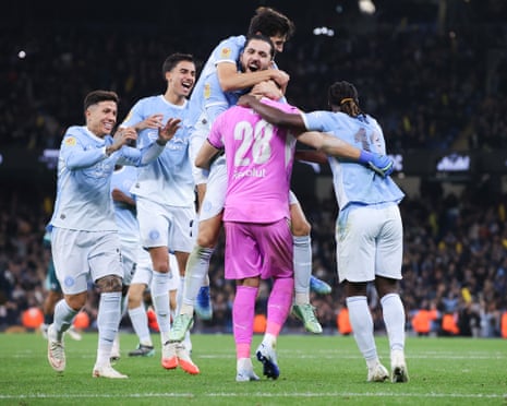Gerónimo Rulli is congratulated by teammates after Manchester CityâÂÂs Carabao Cup fourth round penalty shootout win against Brighton.