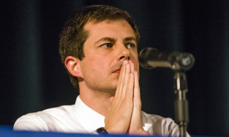 Pete Buttigieg looks on during a town hall community meeting where he faced criticism after the shooting.