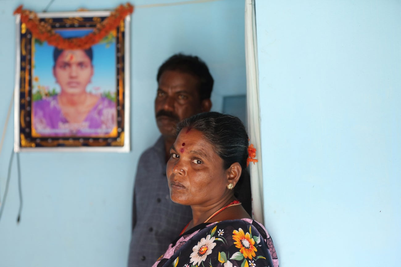 Muthulakshmi and Kathiravel with a portrait of their daughter, Jayasre Kathiravel, a 20-year old Dalit garment worker murdered in Tamil Nadu, India, in January 2021