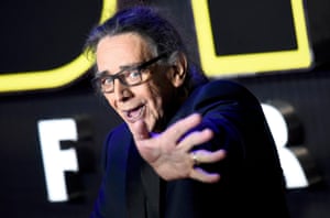 Peter Mayhew, who plays Chewbacca, in the latest Star Wars film waves to the waiting crowds