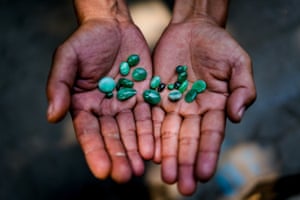 A jade trader displays a selection of his stones for sale.