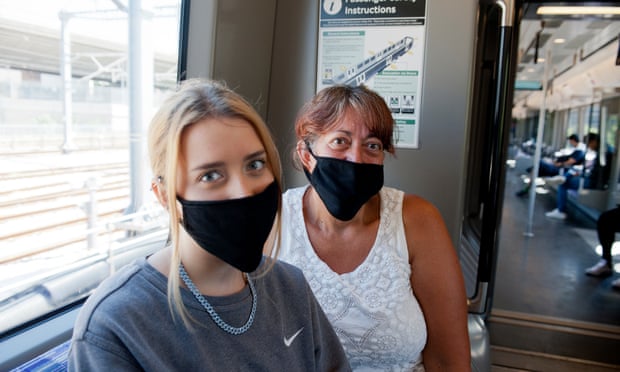 Tanja, right, and Cora Van Wyngaardt were among those to comply with the compulsory wearing of face coverings on public transport.
