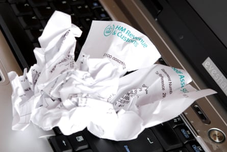 A screwed up and torn HMRC self-assessment tax statement.