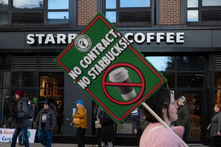 Person holds placard