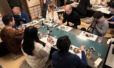 Social influencers from France, Russia, Thailand and South Korea eat whale meat at the Osaka restaurant.