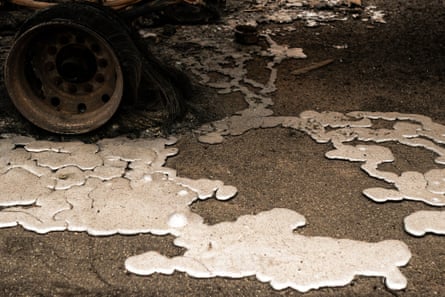 Melted metal on the ground at a burned-out lumber yard on Thursday in Molalla.