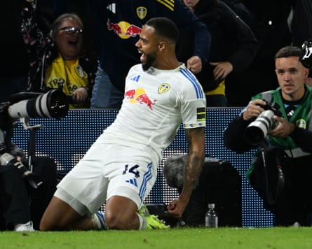 Lukas Nmecha celebrates after converting his penalty for Leeds