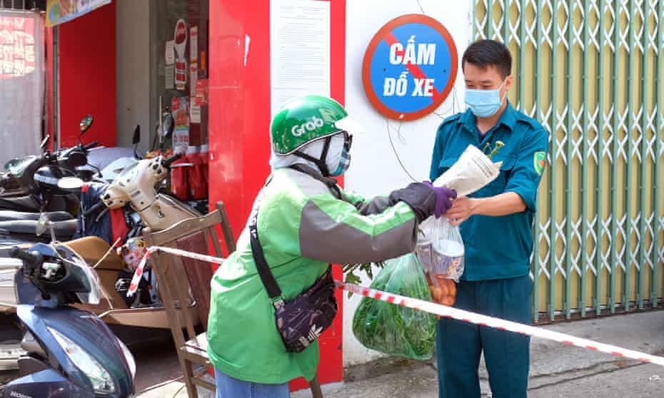A man receives food supplies inside a quarantine area in Hanoi, Vietnam, on 26 May.