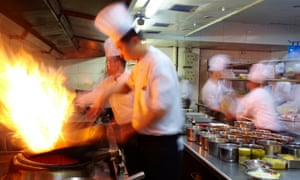 chefs work in a busy kitchen