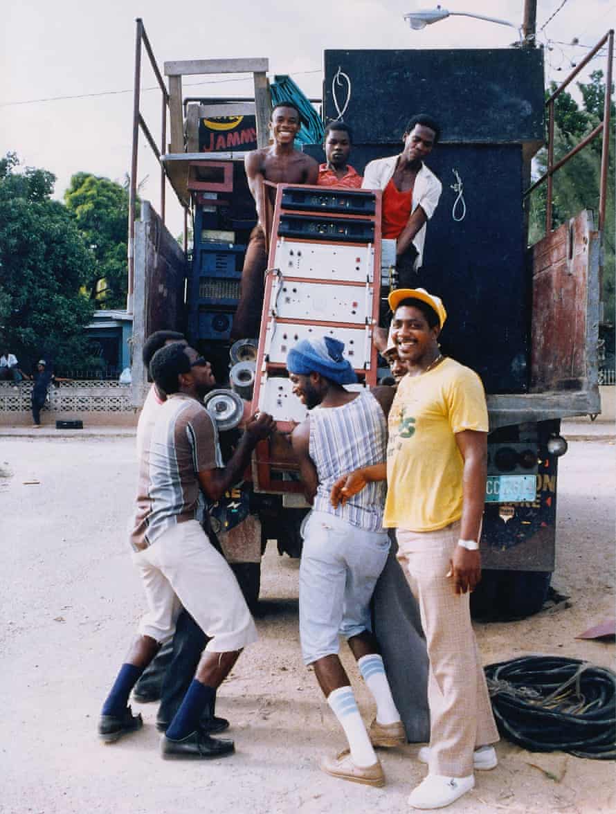 King Jammy’s soundsystem is loaded on to a truck by young men wearing Clarks.