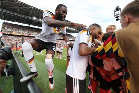 Antonio Rüdiger celebrates with teammates.
