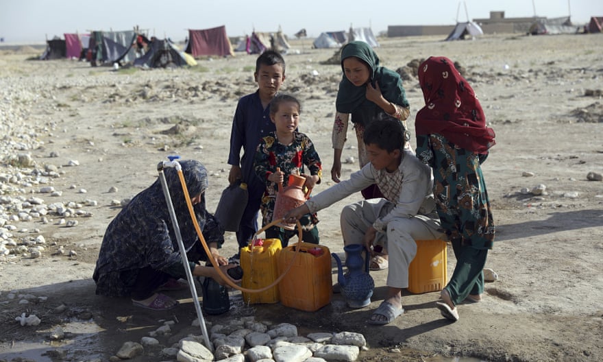 Internally displaced Afghans fleeing fighting between the Taliban and Afghan security forces at a camp near Mazar-e-Sharif, Afghanistan, July 2021