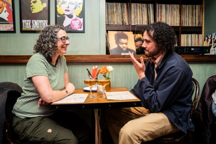 BJ and Toby chatting across a restaurant table