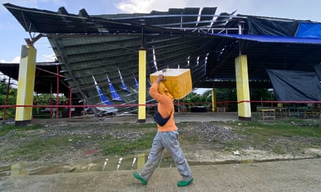 family essay for class 6 Man walks past shelter damaged by earthquake in the Philippines