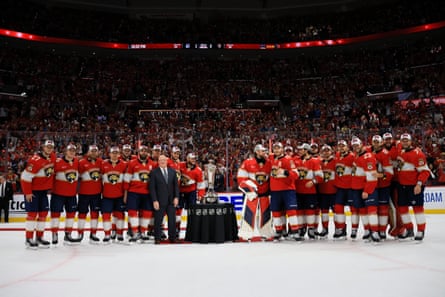 Members of the Florida Panthers pose with the Prince of Wales trophy after defeating the New York Rangers on Saturday night.