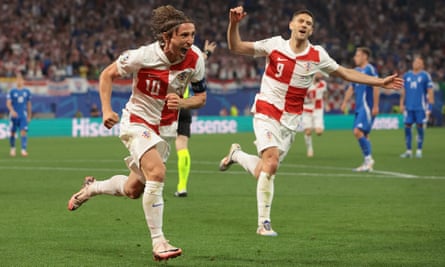 Luka Modric wheels away after putting Croatia ahead moments after missing a penalty